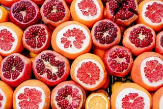 Cut Grapefruits and Pomegranates